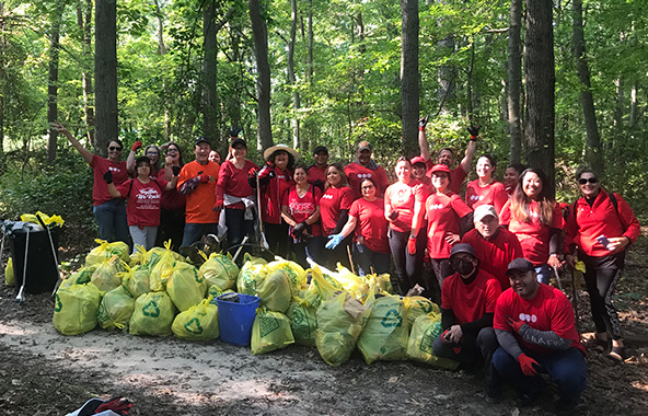 Shiseido Americas employees take part in cleaning a creek and park