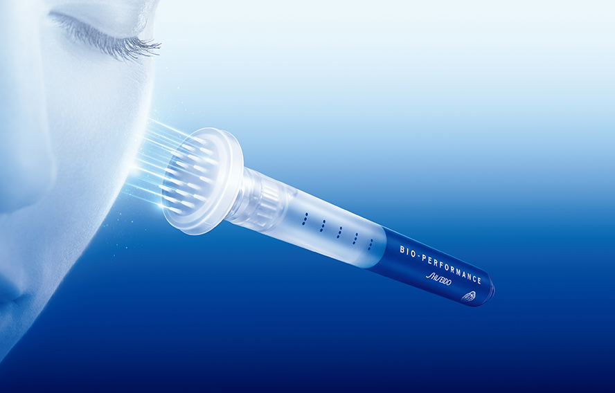 An image of SHISEIDO Bio-Performance Micro Click Concentrate being clicked onto the cheek.